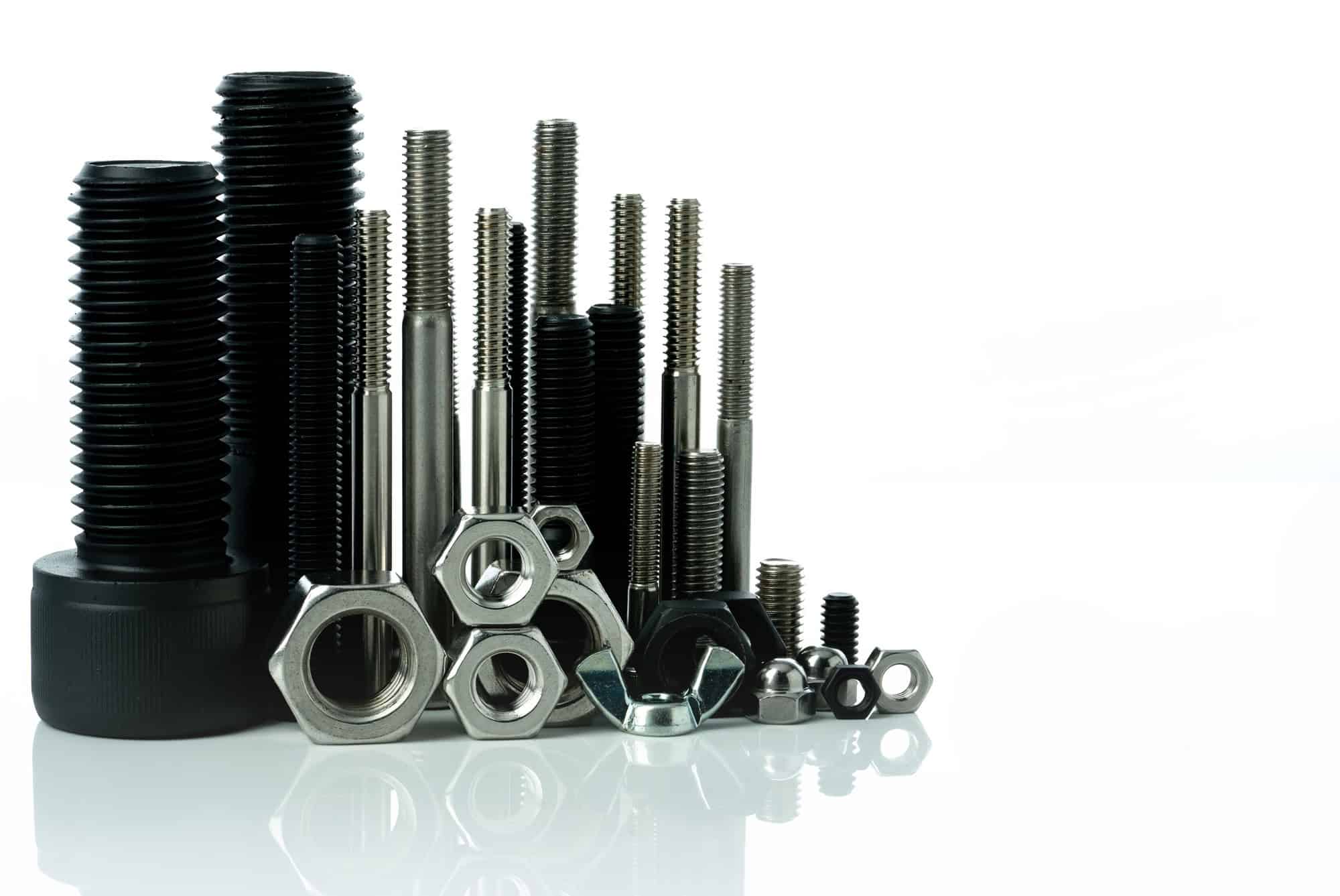 Solution 3 Metal bolts and nuts on white background. Fasteners equipment. Hardware tools. Stud bolt, hex nuts