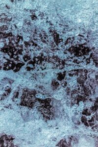 Close-up of textured, treated metal surface showcasing surface treatment effects for enhanced durability and corrosion resistance.