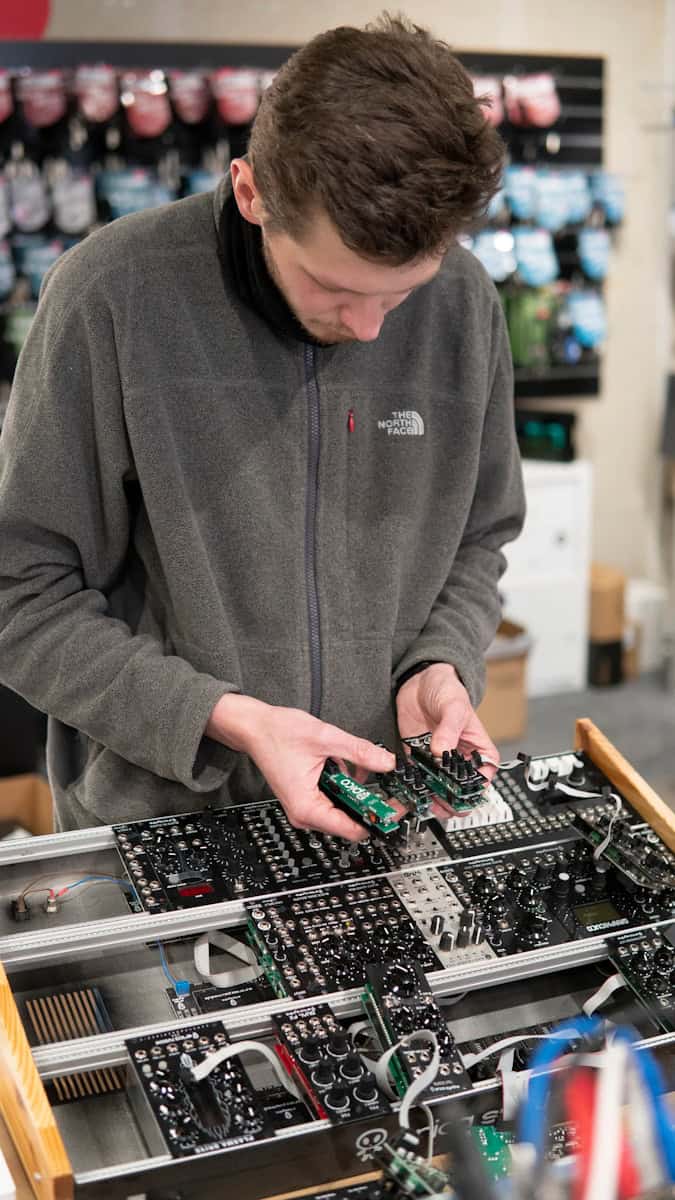 a man working on a machine in a store