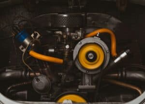 Close-up of an engine with flange bolts and industrial screws used in mechanical assembly.