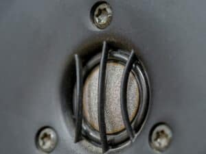 Close-up of a flange bolt with black screws and metallic surface, illustrating industrial fastening components used in engineering connections.