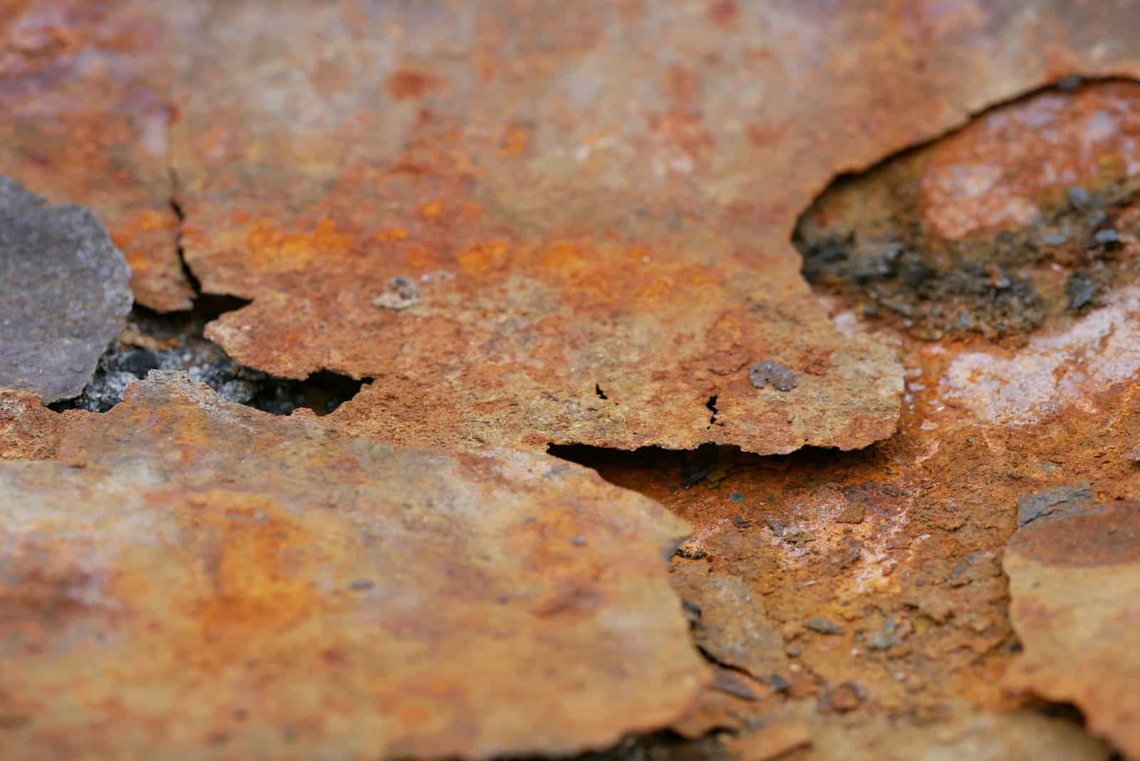 a close up of a rusted metal surface