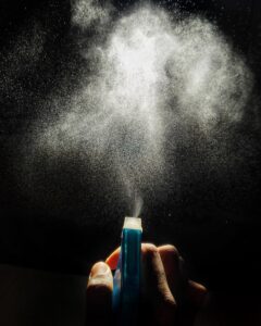 Close-up of a salt spray test chamber releasing mist to evaluate corrosion resistance of industrial screws and bolts.