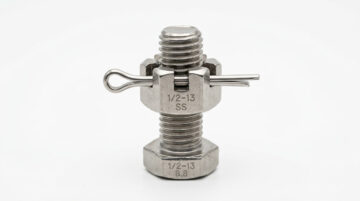 castellated nut — hero illustration showing a stainless steel castle nut with cotter pin on a precision-machined axle bolt