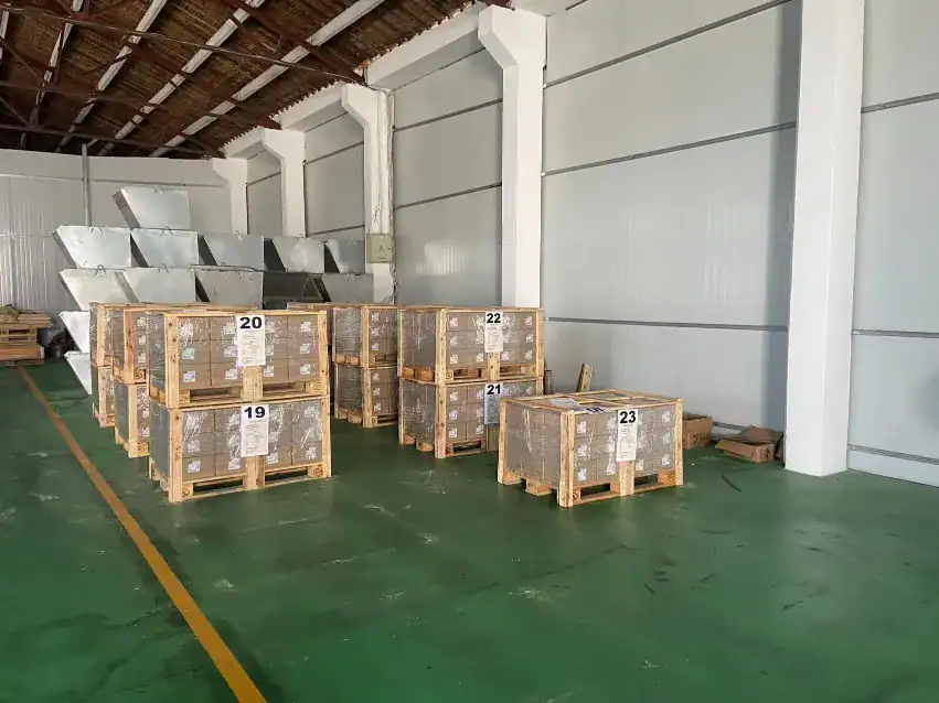 Export-ready fastener cartons packed on wooden pallets inside DingLong Hardware warehouse