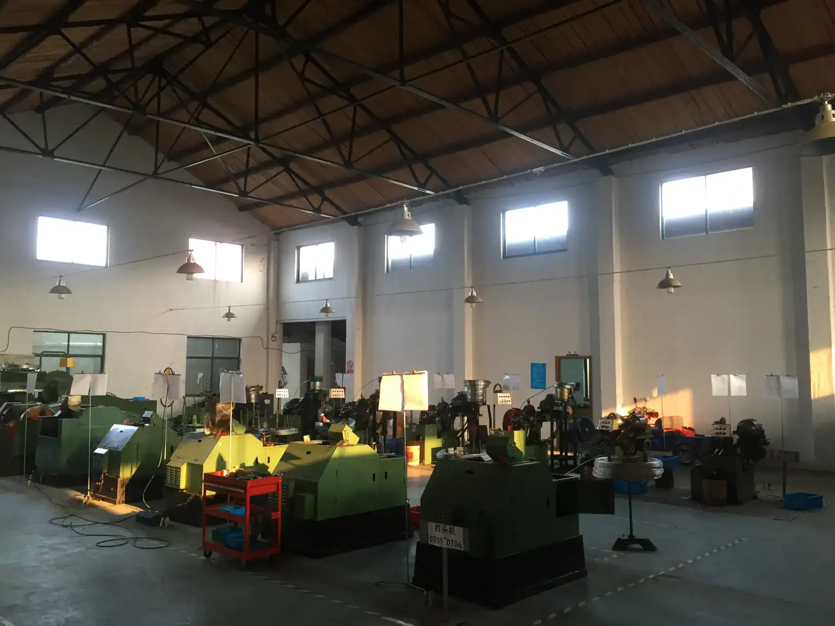Fastener workshop overview with industrial machines inside DingLong Hardware manufacturing facility