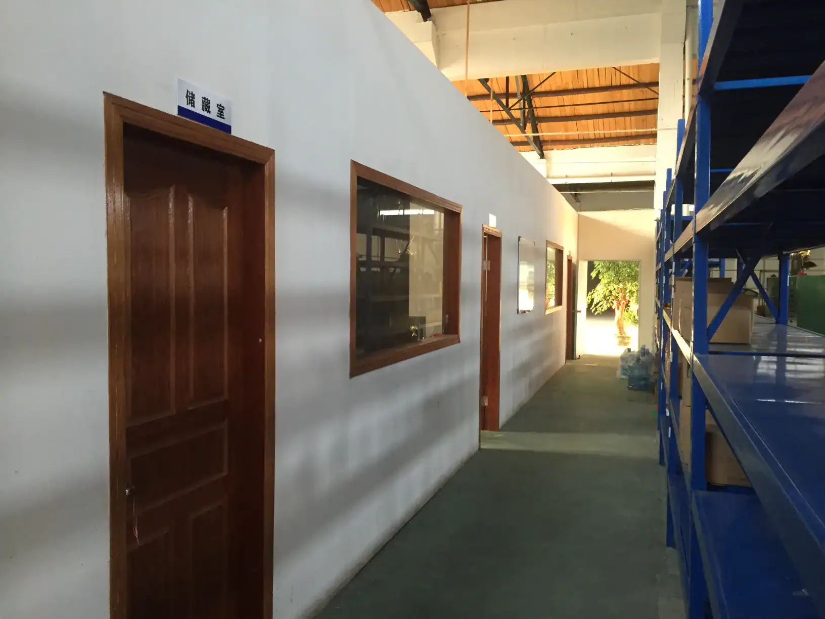 Factory storage area and office corridor inside DingLong Hardware fastener manufacturing facility